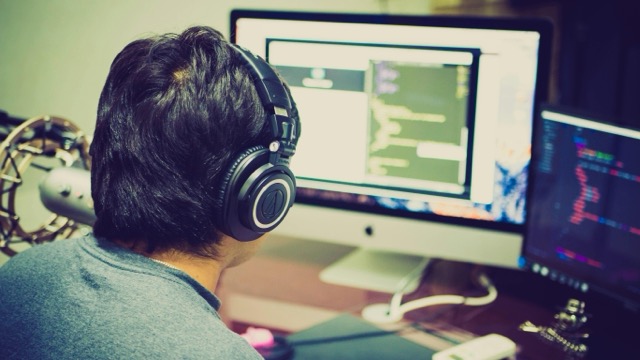 photography of man facing computer looking for in IT Jobs South Africa